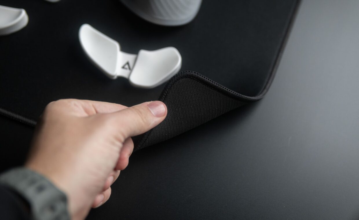 Trackpad closeup hand, photographed for a technology article.