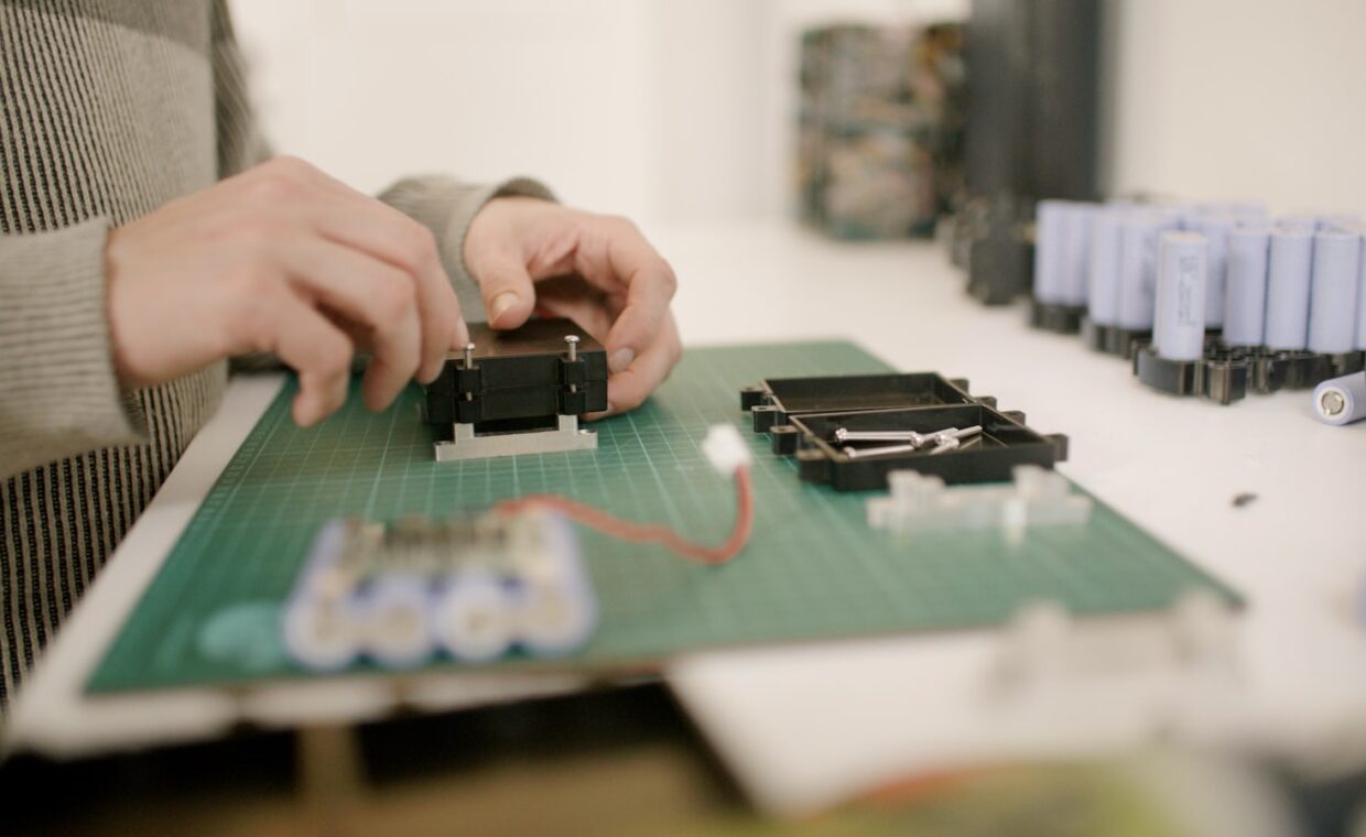 Battery pack teardown, photographed for a technology article.