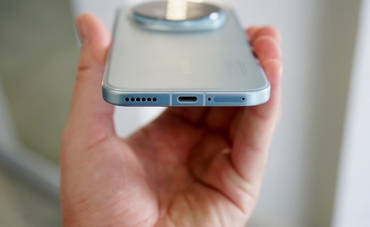 Phone sim tray, photographed for a technology article.