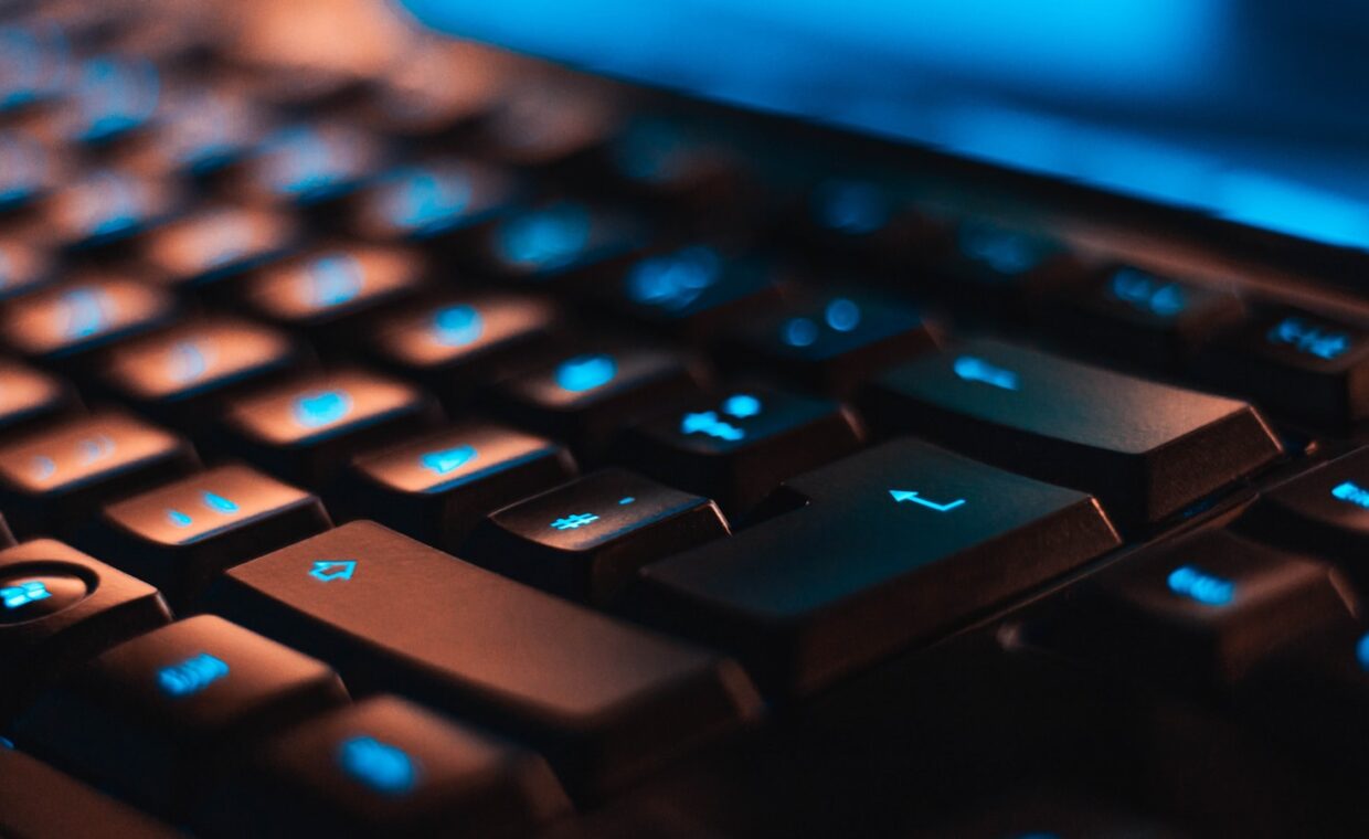 Backlit keyboard dark, photographed for a technology article.