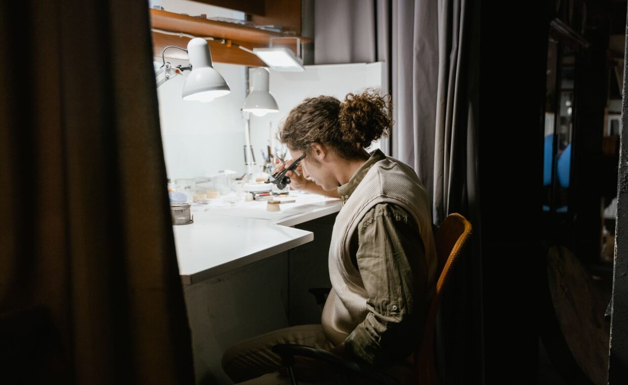 Workbench under lamp, photographed for a technology article.