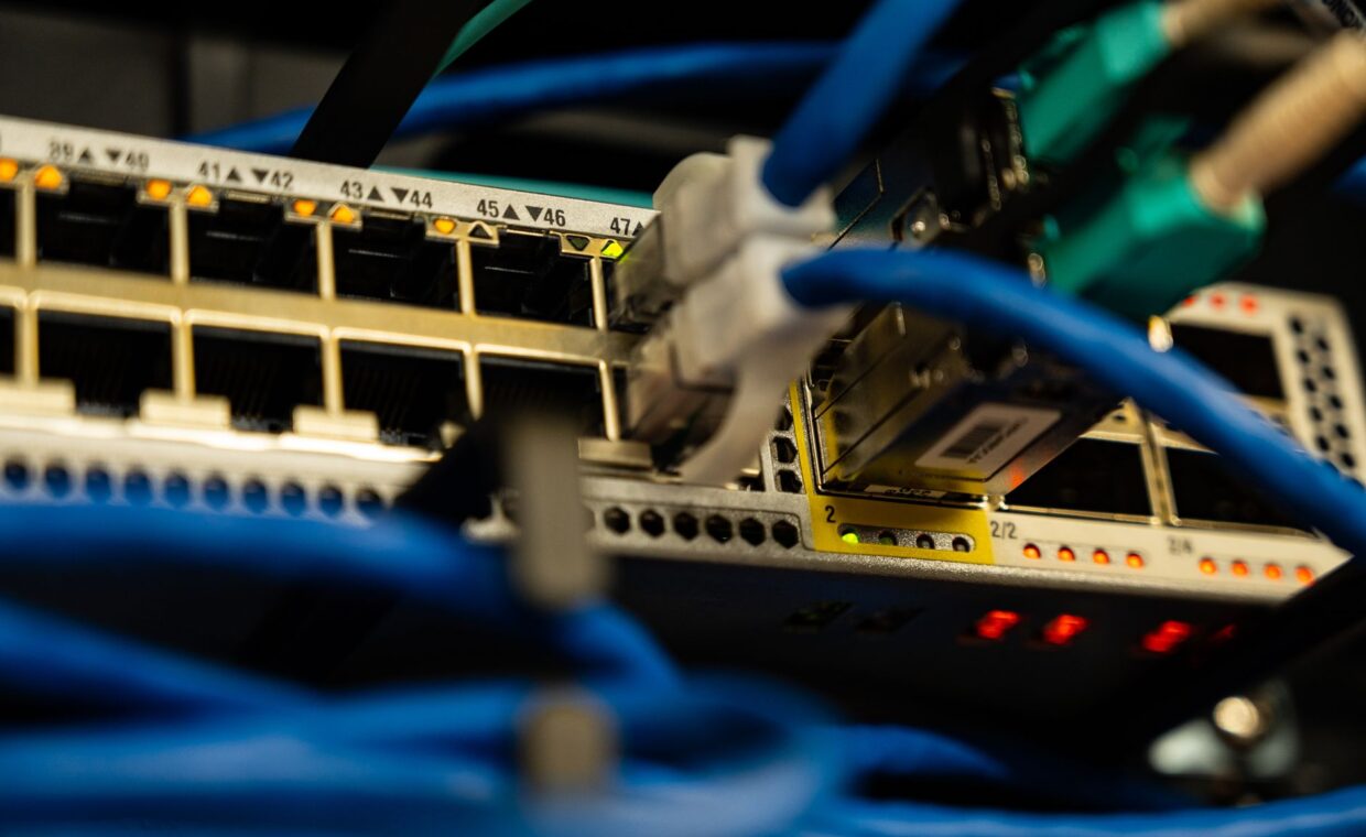 Two routers stacked, photographed for a technology article.