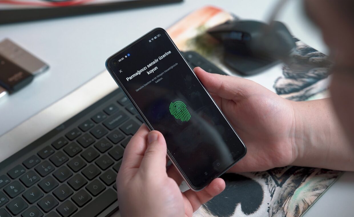 Phone face unlock, photographed for a technology article.