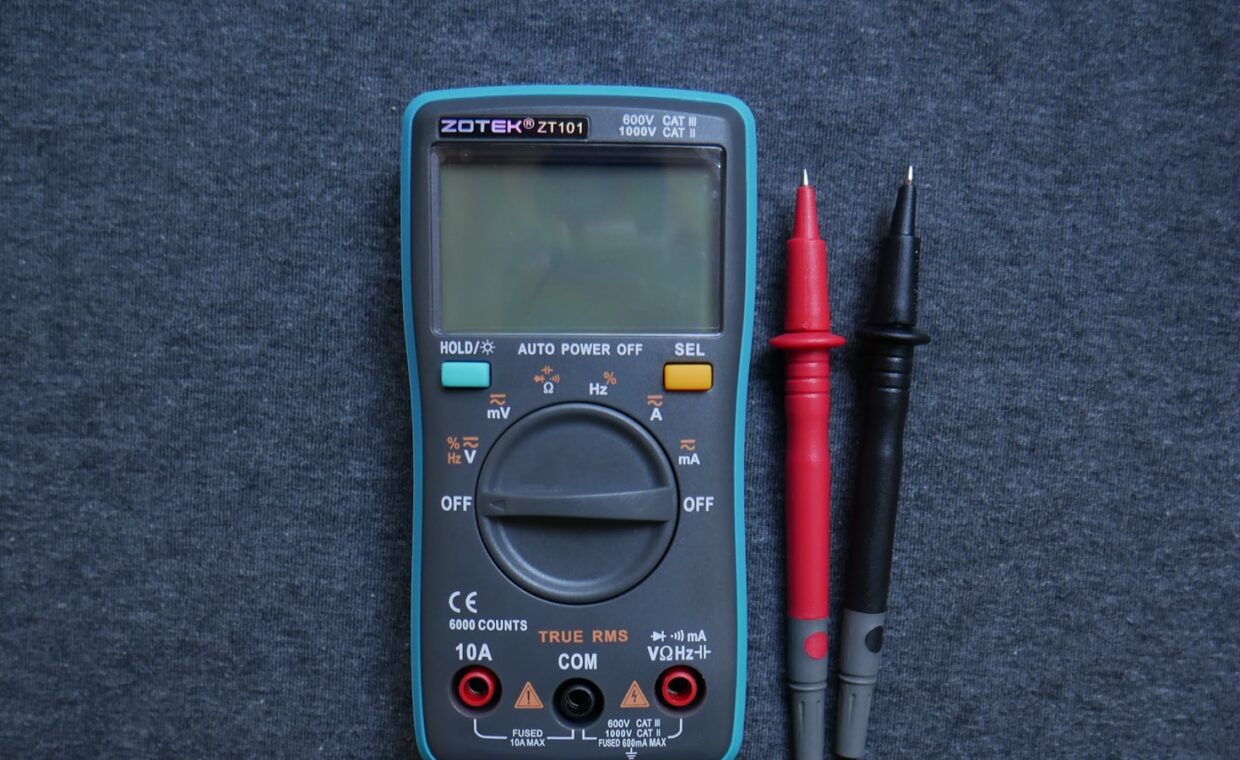 Multimeter probes testing, photographed for a technology article.