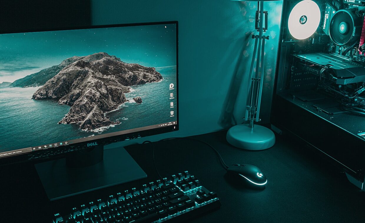 Desktop and laptop, photographed for a technology article.